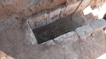  The cist tomb with remains of the interred, looking northwest.
